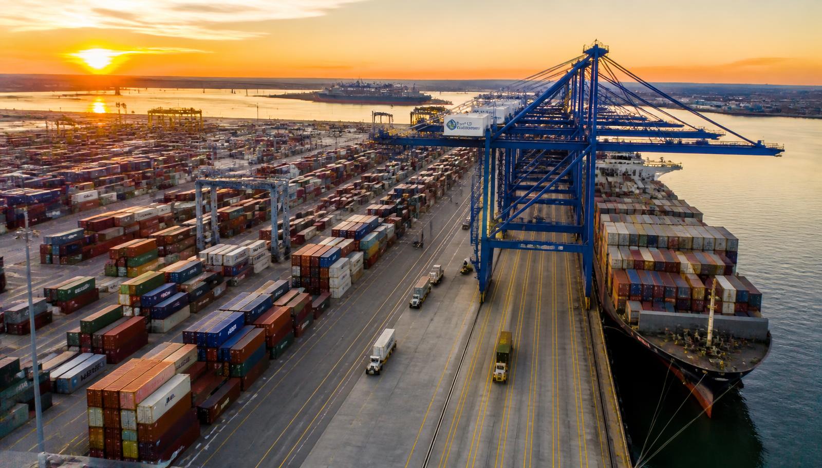 Logistics coordinator reviewing container shipments at a port terminal